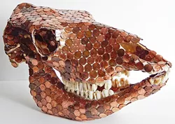 THE GLOW OF DEATH : This cow’s skull covered in shiny pennies by Silas Corley is designed to signify issues with mass consumerism and cheap beef leading to deforestation. - PHOTO COURTESY OF SILAS CORLEY