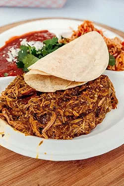 TACO THURSDAY: Carnitas tacos are served up street side with cilantro, radish, onion, salsa roja, and local tortillas. - PHOTO COURTESY OF RICHARD FUSILLO