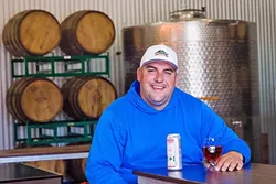 TIN MAN: Andrew Jones, winemaker/owner at Field Recordings, has joined together with Mikey Giugni of Scar of the Sea and Curt Schalchlin, owner/vintner of Sans Liege, to create Tin City Cider Co. in Paso Robles. - PHOTO BY JAYSON MELLOM