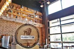 A BARREL WITH YOUR NAME ON IT: Barrel-aged cocktails are flowing at Mason Bar. You can even snag your own exclusive barrel with your name on it (Yes, there’s a current waiting list for that). - PHOTO BY HAYLEY THOMAS CAIN