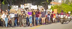 IN THE STREETS: Chants of “Love Trump’s Hate!” and “This is what democracy looks like!” filled the air as protestors marched on downtown SLO Nov. 12. - PHOTO BY JAYSON MELLOM