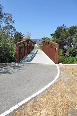 ENTER HERE!: This pedestrian and bike bridge on the corner of Prado Road leads to the newest segment of the Bob Jones Trail that will eventually connect to Avila Beach. - PHOTO BY GLEN STARKEY