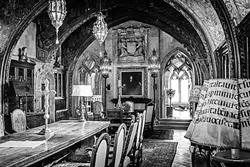 WAR ROOM: From his study, Hearst ran his media empire. The painting of him was done by a childhood friend, while the lampshades are made from the pages of Gregorian monks’ chant books. - PHOTO BY JAYSON MELLOM