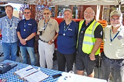 WORLD RECORD HOLDER! :  SLO resident Bernd Schumacher (fourth from left) secured the world record for the largest Z-gauge model train collection on Sept. 17 at Beda&rsquo;s Biergarten. Proprietor Beda Schmidthues stands to his right. - PHOTO BY GLEN STARKEY