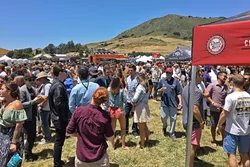 GET IN LINE: The crowds were so thick you needed to get a beer and go directly to another line to keep your glass filled. - PHOTO BY GLEN STARKEY