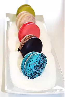 THE TASTY BUNCH : From front to back: passionfruit, double chocolate, rose, Fat Elvis (peanut, banana, bacon), and pistachio macarons at Grover Beach’s Pardon My French Bakery. - PHOTO BY HAYLEY THOMAS CAIN