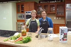 SALTY GALS: Connoisseur Creations President Andrea Wasko and Vice-President Meaghan Gilbert show off the powers of their Quick Pickle Kit. - PHOTO COURTESY OF QUICK PICKLE KIT
