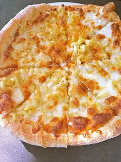 ROOSTER CREEK TAVERN: While Rooster Creek Tavern’s mac ’n’ cheese pizza is a creative twist on a traditional dish, it fell short with the heavy use of truffle oil. - PHOTO BY RYAH COOLEY