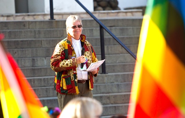 COLLABORATE The Rev. Caroline Hall speaks at the June 7 LGBT rally in Mission Plaza. Hall is one of several local pastors working to create a welcoming community of faith in SLO County. - PHOTO BY JAYSON MELLOM
