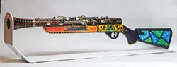 WEAPON OF GOOD Artist Larry Le Brane takes different pieces of clarinets and sculpts them into other things, like a gun, in Turn Instruments of Rage Into Instruments of Joy. - IMAGE COURTESY OF LARRY LE BRANE