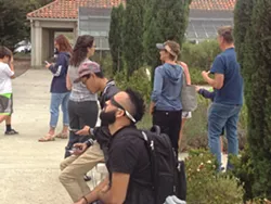 TOTAL ECLIPSE An overcast sky didn't stop people at Cuesta College in SLO from trying to view the total solar eclipse at the school's Bowen Observatory. - PHOTO BY CHRIS MCGUINNESS