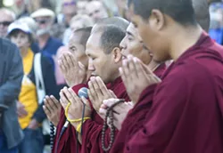 INTERNATIONAL SUPPORT Tibetan monks from the Drepung Loseling Monastery made a special appearance at the vigil for Heather Heyer and other victims of white nationalist and white supremacist violence in Charlottesville. - PHOTO BY JAYSON MELLOM