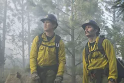 BROTHERHOOD Though at first at odds with one another, new crewmember Brendan McDonough (Miles Teller, left) bonds with veteran Christopher MacKenzie (Taylor Kitsch, right), in the wildfire drama Only the Brave. - PHOTOS COURTESY OF BLACK LABEL MEDIA