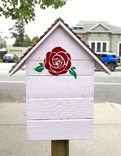 READING RED The Little Free Library in front of SLO Mayor Heidi Harmon's house in the downtown area is stamped with one of her iconic red roses. - PHOTO BY JAYSON MELLOM