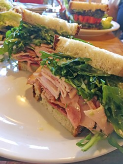 YUM! Smoked turkey, arugula, basil mayo, and deliciously seasoned olive oil make up this sandwich from Industrial Eats in Buellton, and I'm still dreaming about it four days later. - PHOTO BY CAMILLIA LANHAM