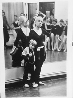 BACK IN THE DAY Lorilee Silvaggio pins down a squirming, young Drew Silvaggio while trying to teach dance class at Academy of Dance, SLO in its early days. - PHOTO COURTESY OF LORILEE SILVAGGIO