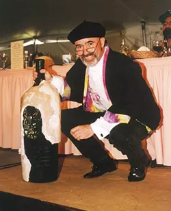 JUST ENOUGH WINE Archie McLaren auctions off an impressively large bottle of wine in 1997 made made just for the Central Coast Wine Classic. - PHOTO COURTESY OF HISTORY CENTER OF SLO COUNTY