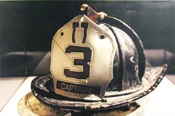 REMEMBERANCE A solitary helmet on display is symbolic of a fallen firefighter. - PHOTO COURTESY OF BECKY SILVA