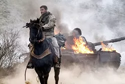 ALL IN In the aftermath of 9/11, Capt. Mitch Nelson (Chris Hemsworth) leads a U.S. Special Forces team into Afghanistan on a dangerous mission in 12 Strong. - PHOTO COURTESY OF WARNER BROS. PICTURES