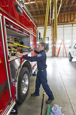 RESPONSIBILITIES Jeff Lane, a reserve firefighter for the Five Cities Fire Authority, must not only respond to emergencies but he is also responsible for the fire truck. - PHOTO BY JAYSON MELLOM