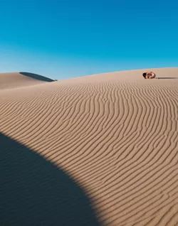 ONE WITH NATURE A photo by Richard Fusillo shows a woman in nature surrounded by zero footprints. It sums up the artist's view on how we should treat the outdoors. - PHOTO COURTESY OF RICHARD FUSSILO