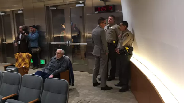 Horton confers with sheriff's deputies as the protest ensued.