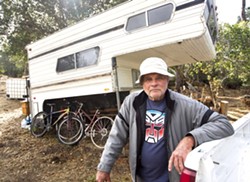 CRIMINAL? William Carlyle, who lost his home in the 2017 Hill Fire, has been charged with two misdemeanors for living on his vacant property in Cambria. - FILE PHOTO BY JAYSON MELLOM