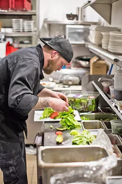 STEAKMASTER Executive Chef Ryan Trimble busies himself with steaks, seafood, and salads at ON Bar in Paso Robles (but, let's be honest, it's mostly steaks). - PHOTO COURTESY OF BY MELISSA MATTSON