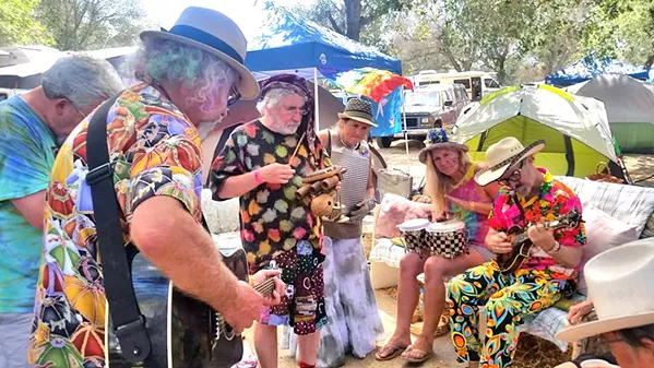 EVERYBODY JAM NOW Live Oak emcee Joe Craven (seated far right) wandered into Camp Ba'ar Nekkid and joined an impromptu jam. - PHOTO COURTESY OF KELLY MCCLEARY
