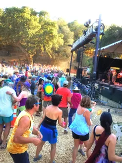COMING TOGETHER The Live Oak Music Festival celebrates 30 years of fundraising with music for KCBX public radio, and longtime attendees will meet again and coalesce into "tribes" that formed over the years at the annual festival. - PHOTO BY GLEN STARKEY