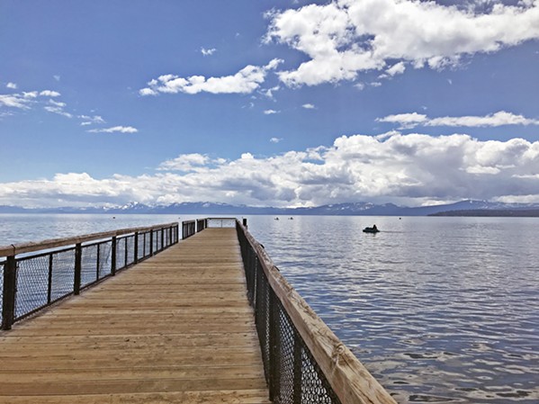 WHAT A VIEW From the pier at Kings Beach, one can see the snowcapped Mountains that surround Lake Tahoe. - PHOTO BY RYAH COOLEY
