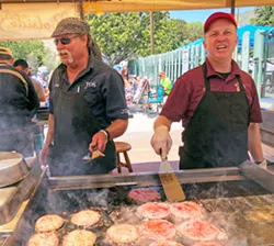 BURGERS, BABY Elks volunteers Jeff and Gary man the poolside grill, dishing up tasty chow. - PHOTO BY GLEN STARKEY