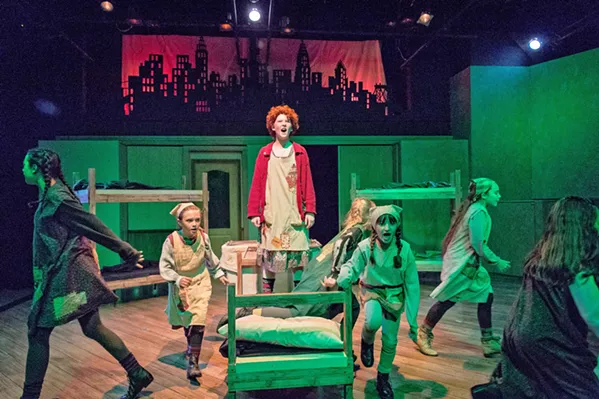 HARD KNOCK LIFE Annie (Liana Lindsey, center) is a girl with a note and half a locket from her birth parents, hoping they'll rescue her from a miserable life at an orphanage. - PHOTO COURTESY OF RYLO MEDIA DESIGN