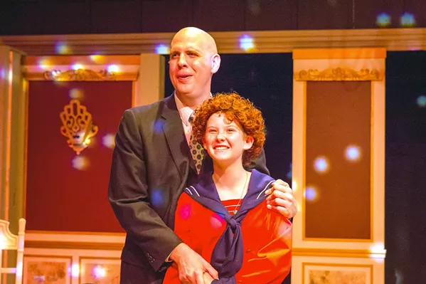 SOMETHING WAS MISSING After spending the holidays together, bachelor and millionaire Oliver Warbucks (Ben Abbot) starts to feel paternal toward Annie (Liana Lindsey). - PHOTO COURTESY OF RYLO MEDIA DESIGN