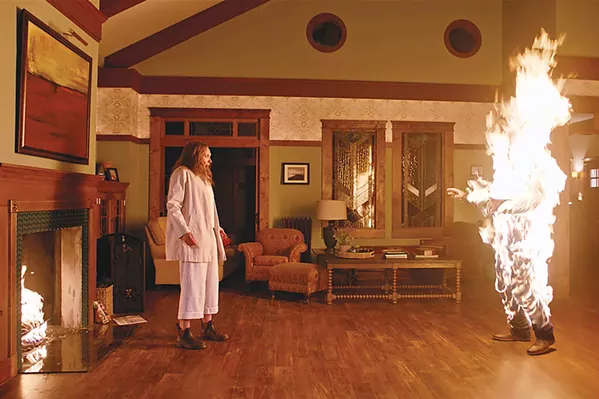 DEVIL'S DEBT Annie (Toni Collette) watches in horror as her loved one spontaneously bursts into flames. - PHOTO COURTESY OF A24 AND PALMSTAR MEDIA