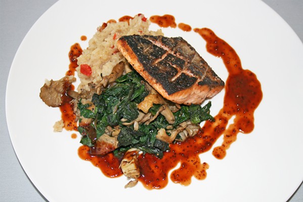 LABOR OF LOVE A portion of wild mushroom rainbow chard offers a tender, earthy bite in contrast with flavorful seared Pacific salmon topped with syrah barbecue sauce. - PHOTO BY HAYLEY THOMAS CAIN
