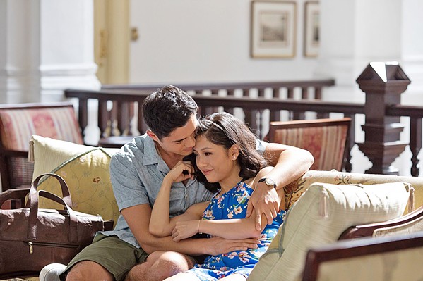 LOVE AND MONEY New York economics professor Rachel Chu (Constance Wu, right) travels to Singapore to meet her boyfriend, Nick Young's (Henry Golding), ridiculously wealthy family, in Crazy Rich Asians, based on Kevin Kwan's best selling novel. - PHOTO COURTESY OF WARNER BROS.
