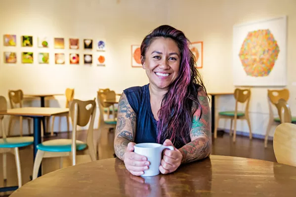 A FRESH SPACE, SAME FACES Longtime manager Kalae Neves and many of the baristas behind the counter have stayed on as Steynberg Gallery has transitioned to The 4 Cats Café and Gallery. - PHOTO BY JAYSOM MELLOM