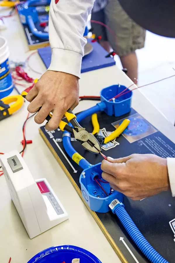 LEARN A TRADE Career and technical education programs at colleges like Cuesta allow students to get hands-on training and skills to help them get jobs in a number of industries, including electrical technology (above), agriculture, law enforcement, and many others. - PHOTO BY JAYSON MELLOM