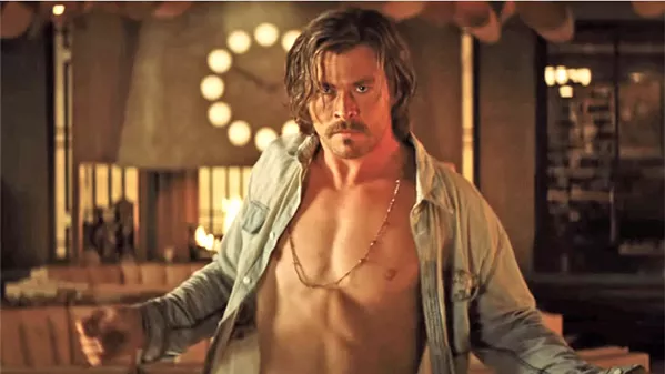 DARK CHARISMA Chris Hemsworth stars as Charles Manson-like cult leader Billy Lee, who rains down holy hell on the El Royale hotel. - PHOTOS COURTESY OF TWENTIETH CENTURY FOX