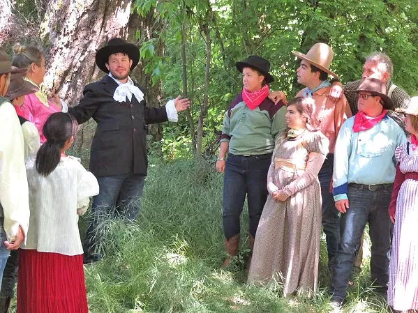 POLITICAL DANCE Senator Beauregard (Jason Cantu, center) tries to drum up support for his re-election among the townsfolk of Dairy Gulch. - PHOTO COURTESY OF SEAN MCALPINE