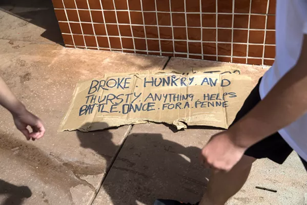 SIGN OF THE TIMES SLO's homeless population is a fixture of the city. Police say they try to reach out to offer help and services before citing and arrest homeless individuals. Still others worry that some of the city's laws penalize people because they are homeless. - PHOTO BY JAYSON MELLOM