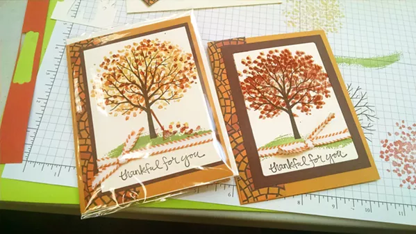 EXPECTATIONS VS. REALITY My Thanksgiving card (right) came out almost identical to the example card (left) we were given, minus a rake and some leaves. - PHOTO BY CALEB WISEBLOOD