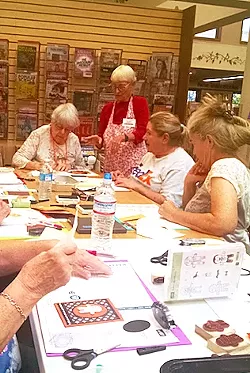 CLASS IN SESSION Stampin' Up demonstrator Suzy McBride hosts Stamp Camp workshops throughout the year at libraries, fundraising events, and her own home. - PHOTO BY CALEB WISEBLOOD