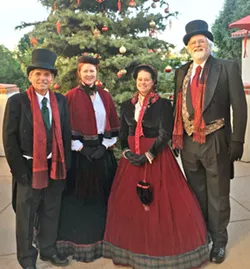 VICTORIAN MOTIF! The Uncommonne Carolers, (left to right) Craig Updegrove, Karla Santare, Meagan Glimpse, and Chuck Hiigel, perform everything from church hymns to modern popular holiday songs arranged both simply and in more complicated jazz and classical styles. - PHOTO COURTESY OF LINDA A. WILSON
