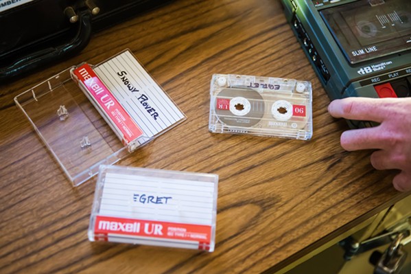 ESCAPE ARTISTS Escape rooms are designed to immerse players in a specific theme. The Lock Boxx, a SLO-based mobile escape room, is set in a kidnapped FBI agent's office, which is packed with clues such what's on these cassette tapes. - PHOTO BY JAYSON MELLOM