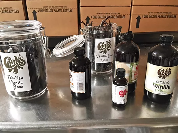 OLD SCHOOL FLAVOR A sister effort of The Wine History Project of SLO County, the Food History Project, is known to take field trips to explore historical food. The group visited Cook's Flavoring Company in Paso Robles this past summer, celebrating the company's 100-year anniversary churning out potent vanilla extract, among other delights. - PHOTOS COURTESY OF WINE HISTORY PROJECT