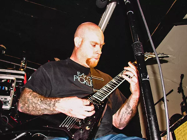 SHREDDER Known for his technical proficiency, Erik R. Lindmark (pictured) also fronted local metal band Charlie Christ. Two other local metal bands—Cryptolith and Stone Mountain—will play his celebration of life on Dec. 20, in Sweet Springs Saloon. - PHOTO COURTESY OF GISELE KINGSTON
