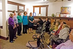IN REMEMBRANCE At Hospice SLO County's annual Paws to Remember ceremony on Dec. 10, the Threshold Singers sang calming musical numbers for grieving pet owners. - PHOTO BY JAYSON MELLOM