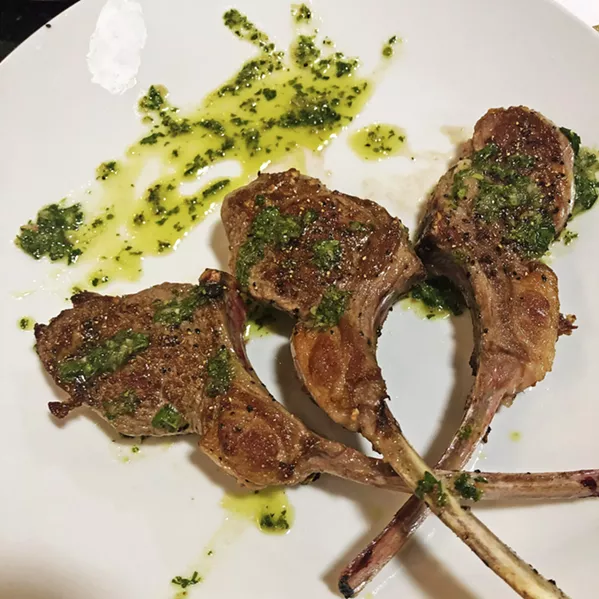 LOLLICHOPS Chef Jacob Lovejoy of love.joy.eat Private Catering eyes the lamb lollipops cooked and plated by KJUG radio personalities Tom Keffury and Becky Kingman. - PHOTOS BY HAYLEY THOMAS CAIN